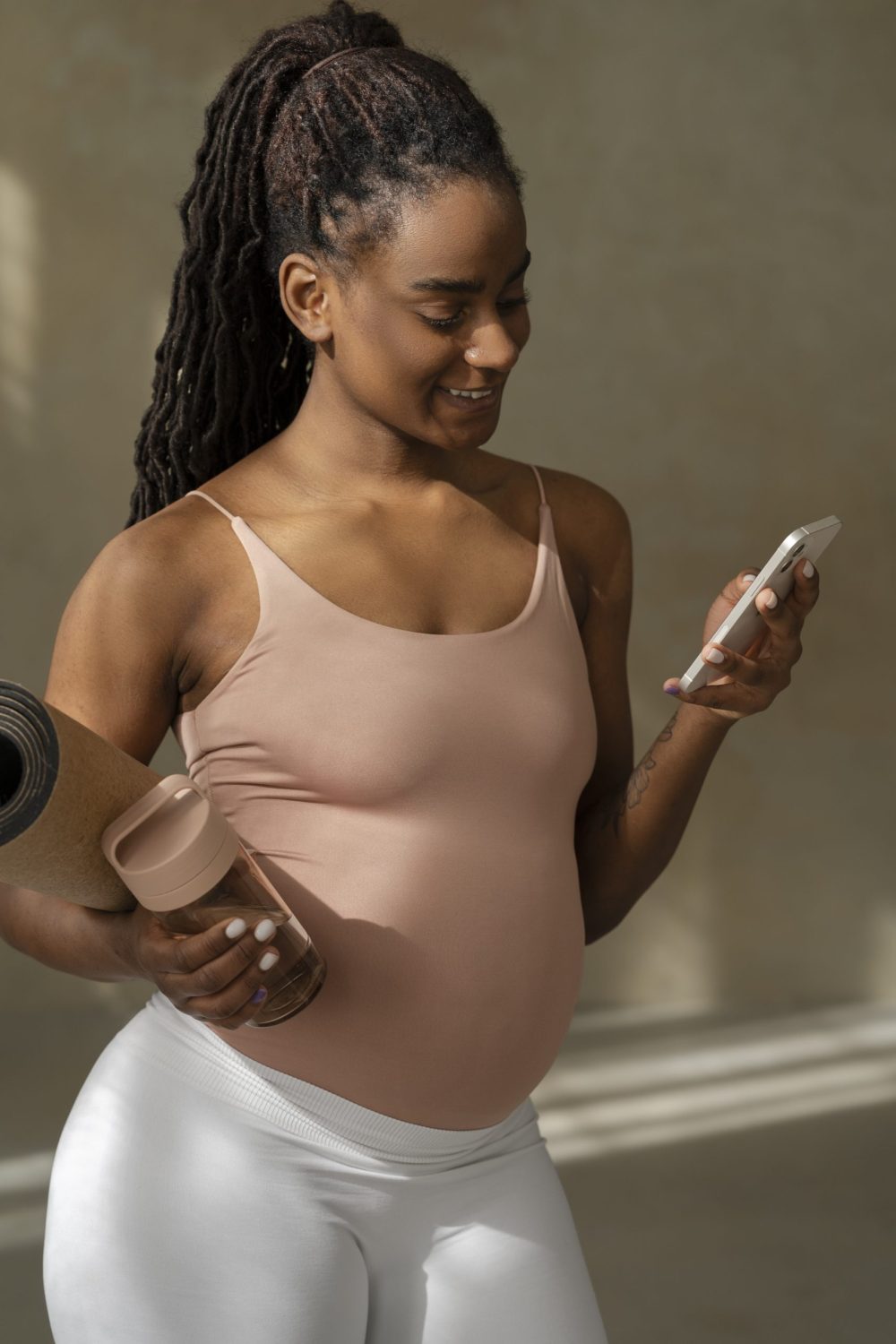 pregnant woman smiling after exercising